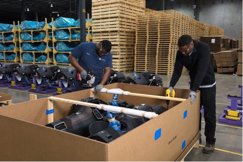 Custom Packaging Solutions staff boxing up a Kontane Logistics Project
